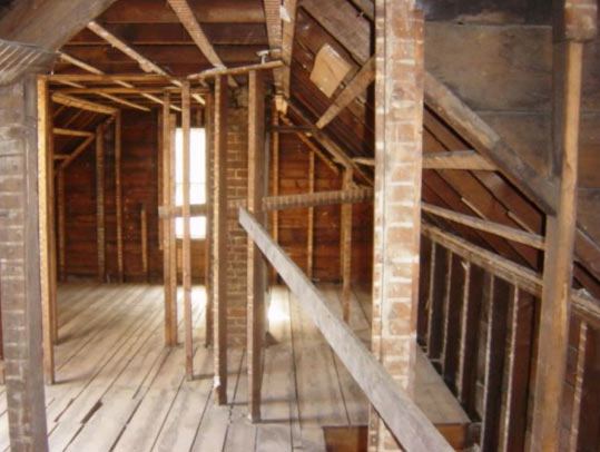 Interior demolition down to the studs in a residential attic